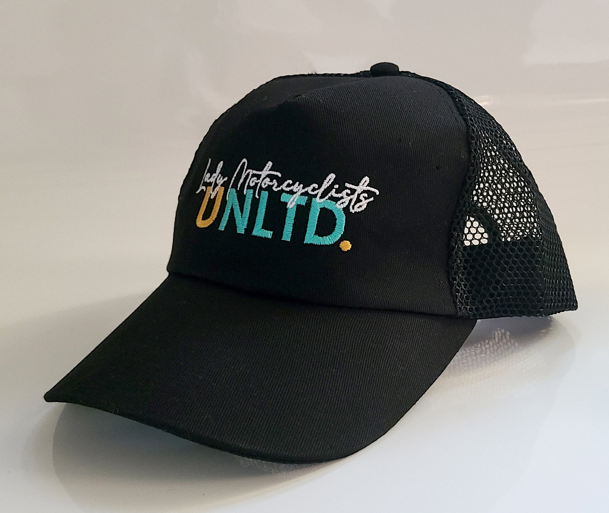 side view embroidered Lady Motorcyclists Unlimited trucker style cap